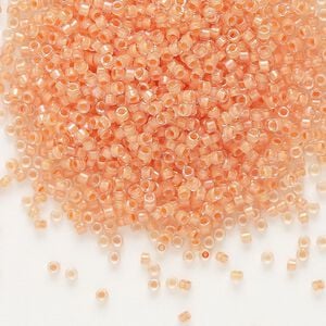 Seed bead, Delica&reg;, glass, pkg/7.5g, #11 round, translucent peach-lined luster crystal clear (DB-0068).