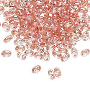 Seed bead, Preciosa Twin&trade; Czech glass, pkg/250g, 5x2.5mm oval, transparent peach terra color-lined clear, (38689).
