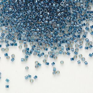 Seed bead, Delica&reg;, glass, pkg/7.5g, #11 round, translucent blue-lined luster topaz (DB-0921).