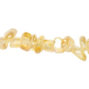 Bead, glass, translucent light orange AB, medium chip with 0.6-0.8mm hole. Sold per 32-inch strand, approximately 290-320 beads.