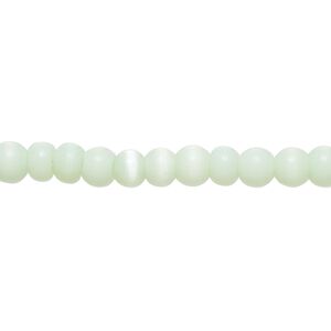 Bead, cat's eye glass (fiber optic glass), mint green, 4-6mm irregular round. Sold per 14-inch strand, approximately 90 beads.