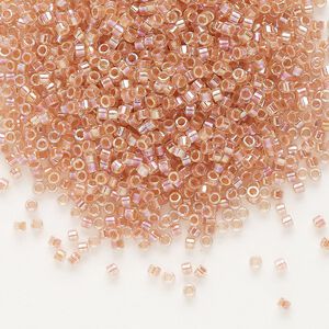 Seed bead, Delica&reg;, glass, pkg/7.5g, #11 round, translucent peach-lined rainbow crystal clear (DB-0054).