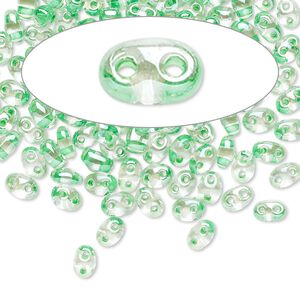 Seed bead, Preciosa Twin&trade; Czech glass, pkg/50g, 5x2.5mm oval, transparent light green terra color-lined clear, (38656).