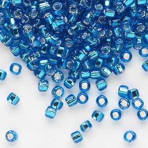 Seed bead, Dyna-Mites&trade;, glass, silver-lined translucent turquoise blue, #6 round with square hole. Sold per 40-gram pkg.