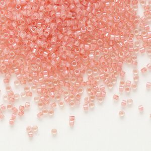 Seed bead, Delica&reg;, glass, pkg/7.5g, #11 round, translucent coral-lined luster crystal clear (DB-0070).