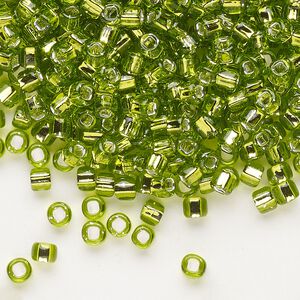 Seed bead, Dyna-Mites&trade;, glass, silver-lined translucent light green, #6 round with square hole. Sold per 1/2 kilogram pkg.