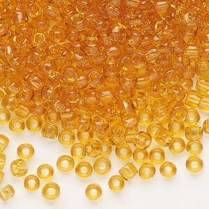 Seed bead, Dyna-Mites&trade;, glass, transparent light amber yellow, #6 round. Sold per 1/2 kilogram pkg.