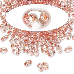 Seed bead, Preciosa Twin&trade; Czech glass, pkg/10g, 5x2.5mm oval, transparent peach terra color-lined clear, (38689).