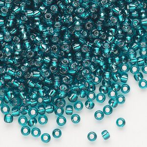 Seed bead, Dyna-Mites&trade;, glass, silver-lined translucent teal blue, #8 round. Sold per 1/2 kilogram pkg.