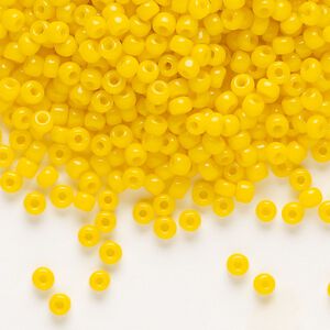 Seed bead, Dyna-Mites&trade;, glass, opaque dark yellow, #8 round. Sold per 1/2 kilogram pkg.