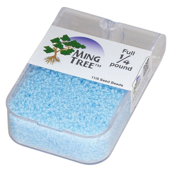Seed bead, Ming Tree&trade;, glass, pkg/1/4 pound, #11 round, transparent color-lined aqua. image number 0