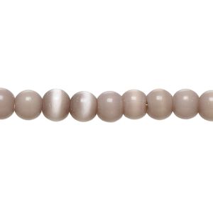 Bead, cat's eye glass (fiber optic glass), light purple, 5-7mm irregular round. Sold per 14-inch strand, approximately 70 beads.