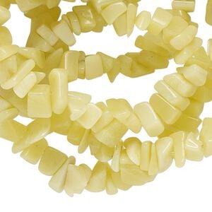 Bead, peridot new "jade" (serpentine) (natural), medium chip with 0.4-0.6mm hole, Mohs hardness 2-1/2 to 6. Sold per 34-inch strand.