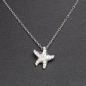 Necklace, Create Compliments&reg;, cubic zirconia and sterling silver, clear, 11mm starfish, 18 inches with springring clasp. Sold individually.