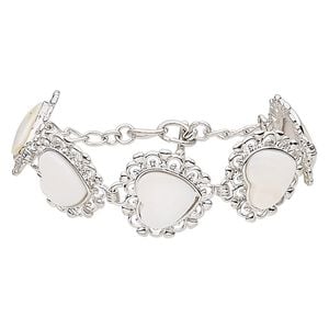 Bracelet, gold lip shell (natural) with silver-finished brass and steel, 23x22mm heart, 7 inches with toggle clasp. Sold individually.