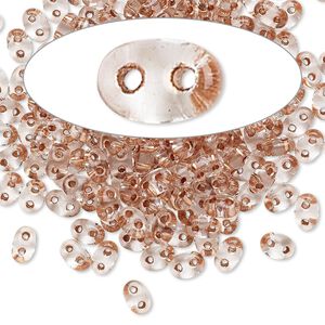 Seed bead, Preciosa Twin&trade; Czech glass, pkg/10g, 5x2.5mm oval, transparent copper color-lined clear, (68105).