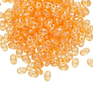 Seed bead, Preciosa Twin&trade; Czech glass, pkg/10g, 5x2.5mm oval, translucent peach terra pearl clear, (08392).