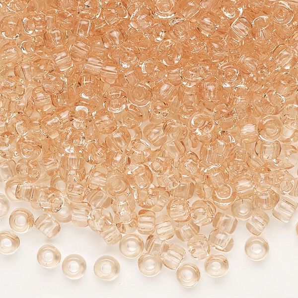 Seed bead, Dyna-Mites&trade;, glass, transparent light peach, #6 round. Sold per 1/2 kilogram pkg. image number 0