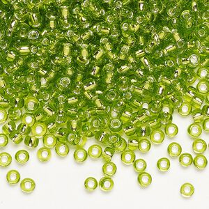 Seed bead, Dyna-Mites&trade;, glass, silver-lined translucent light green, #8 round. Sold per 1/2 kilogram pkg.