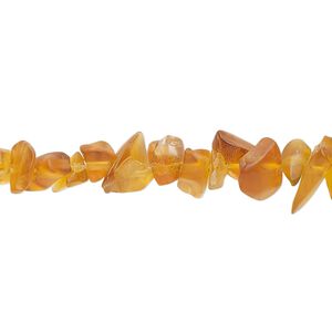 Bead, glass, translucent golden brown, small to extra-large chip. Sold per 30-inch strand.