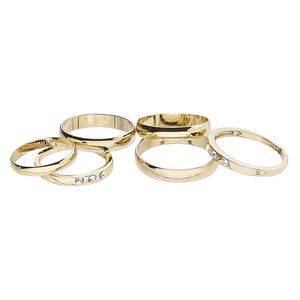 Ring mix, glass rhinestone and gold-finished brass, clear, 3mm and 4mm wide, size 5 to 12-1/2. Sold per pkg of 6.