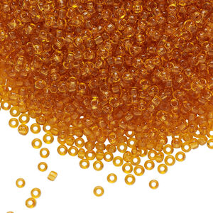 Seed bead, glass, pkg/50g, #10 rocaille, transparent topaz.