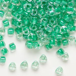 Seed bead, Miyuki, glass, transparent clear color-lined kelly green, (TR1130), #5 triangle. Sold per 250-gram pkg.