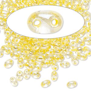 Seed bead, Preciosa Twin&trade; Czech glass, pkg/10g, 5x2.5mm oval, transparent yellow terra color-lined clear, (38686).