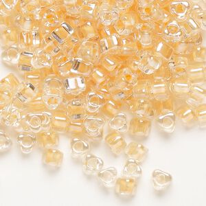 Seed bead, Miyuki, glass, transparent clear color-lined tawny, (TR1131), #5 triangle. Sold per 250-gram pkg.