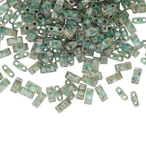 Seed bead, TILA&reg;, glass, pkg/10g, 5x2.3mm half tila rectangle, translucent Picasso turquoise blue, (HTL-4506).