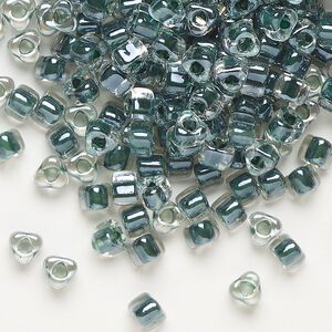 Seed bead, Miyuki, glass, transparent clear color-lined steel blue, (TR1127), #5 triangle. Sold per 250-gram pkg.