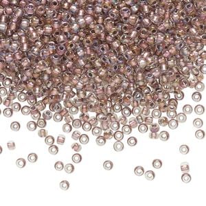Seed bead, TOHO BEADS&reg;, glass, pkg/250g, #11 round, translucent rose gold-lined crystal clear (TR-11-267).