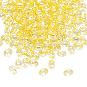 Seed bead, Preciosa Twin&trade; Czech glass, pkg/250g, 5x2.5mm oval, transparent yellow terra color-lined clear, (38686).